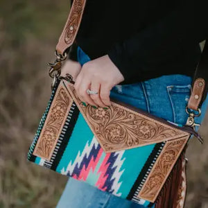 Saddle blanket crossbody with tooled leather